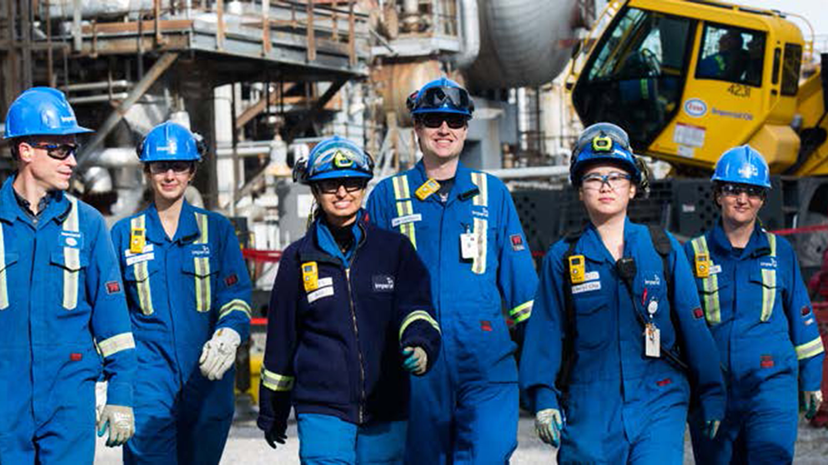 group of refinery workers in their PPE (personal protective equipment)