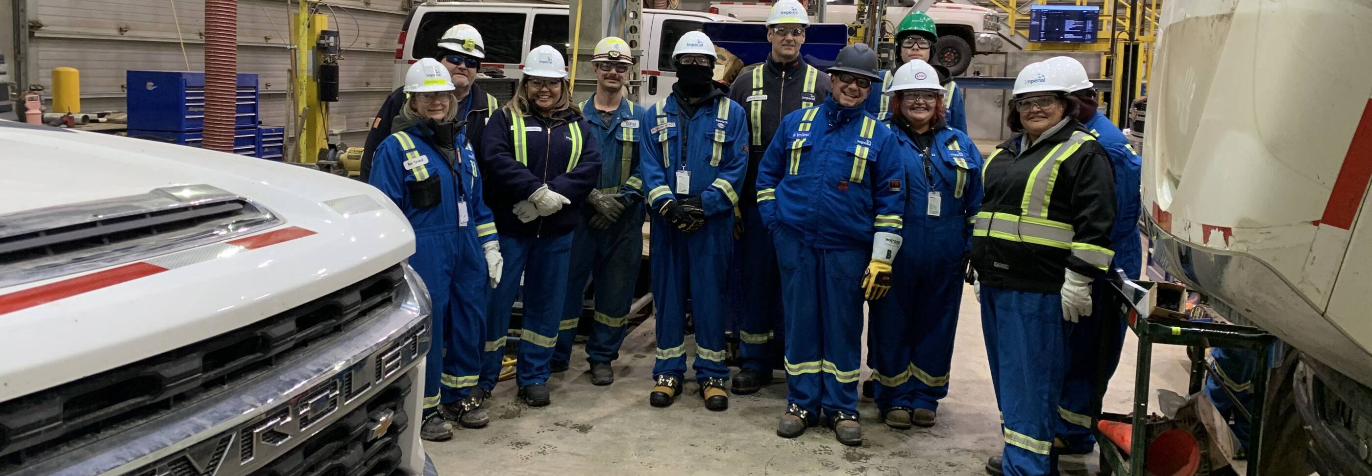 Indigenous youth tour heavy equipment / engineering activities at Kearl facility.