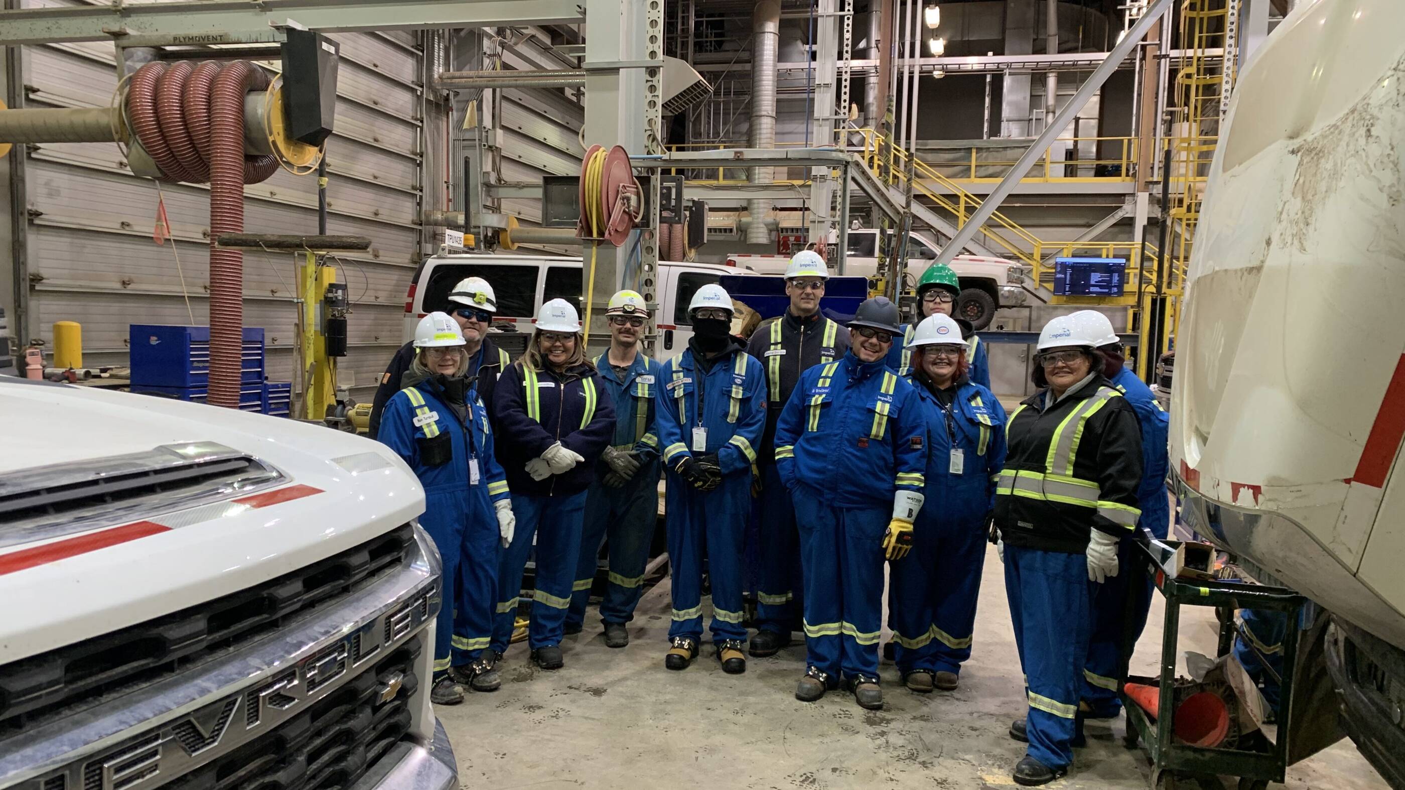 Indigenous youth tour heavy equipment / engineering activities at Kearl facility.