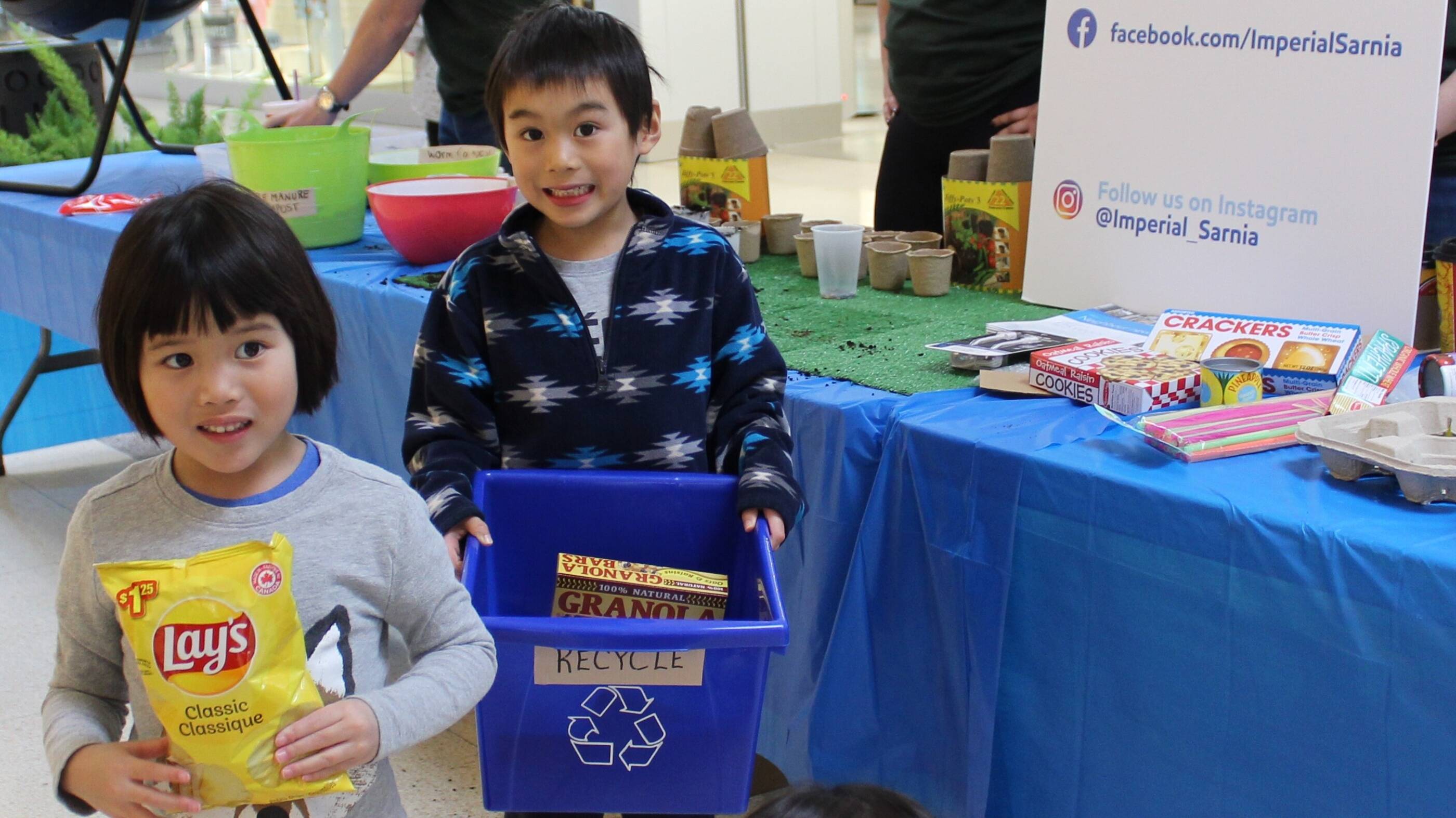 Imperial's youth showing how to sort various waste
